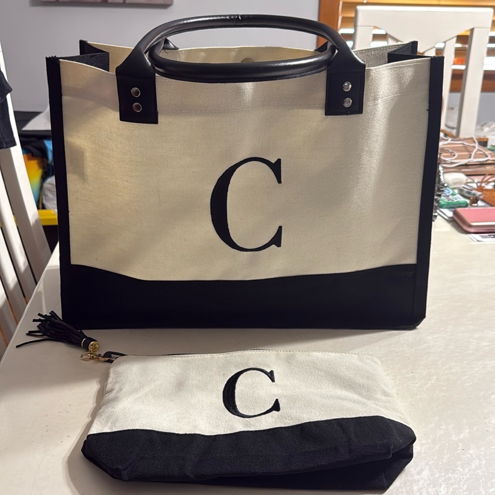 Brand new never worn “C” tote bag and small pouch